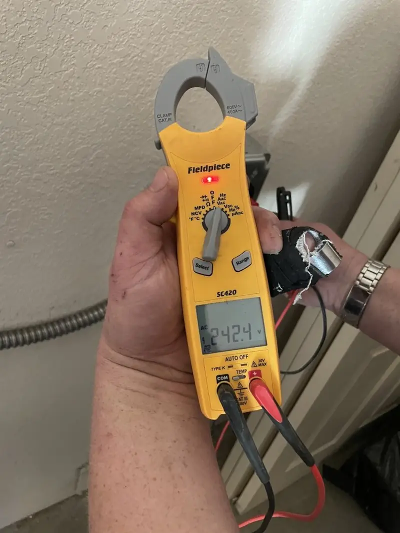 Voltage testing with clamp meter during Recessed Lighting Installation in Dentsville